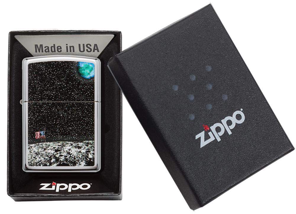 Front view of the High Polish Chrome Moon Landing Design Lighter in hand, open and lit